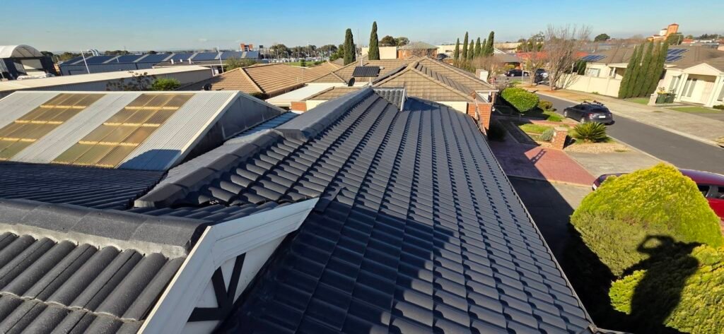 After: restored charcoal tiled roof with painted ridge capping and gable in Sydenham