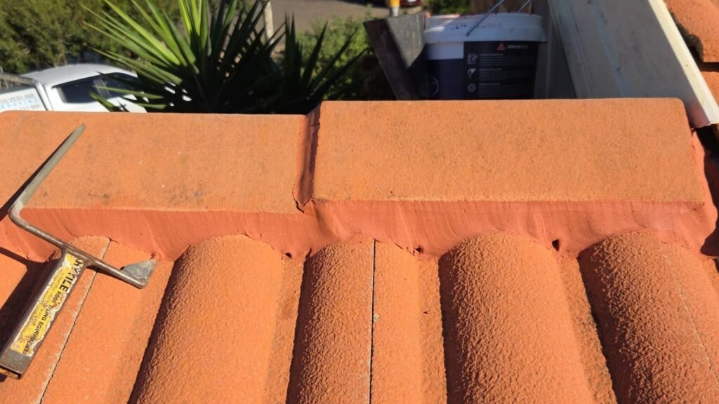 Close-up of a repointed ridge cap with fresh flexible pointing in Hillside
