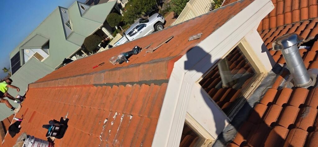 Roof repointing in progress on a tiled roof in Hillside